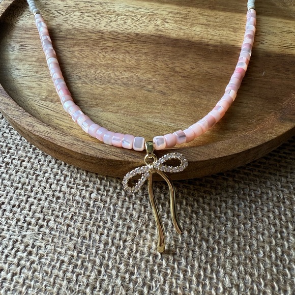 Pink Shell Beaded Necklace with Gold Bow Pendant - Picture 1 of 3